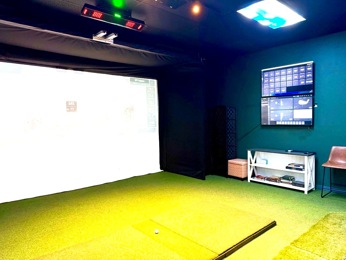 Premium golf simulator bay with ambient lighting
